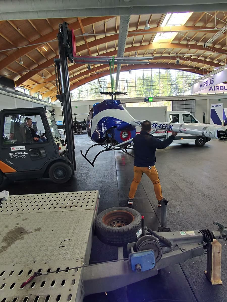 ARGO AH helicopter moved into position at AERO Friedrichshafen, the Airbus stand in the background
