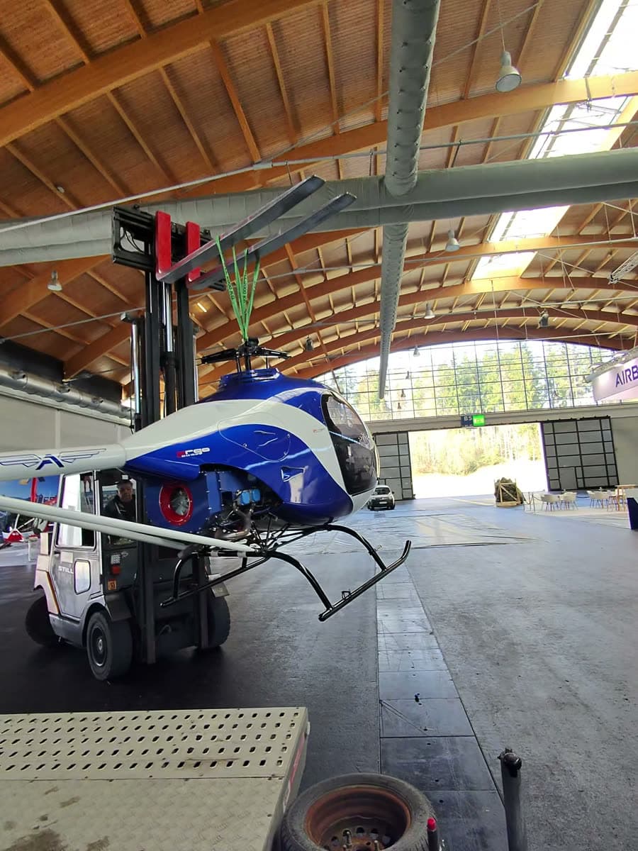 ARGO AH helicopter being lifted off the trailer at AERO Friedrichshafen