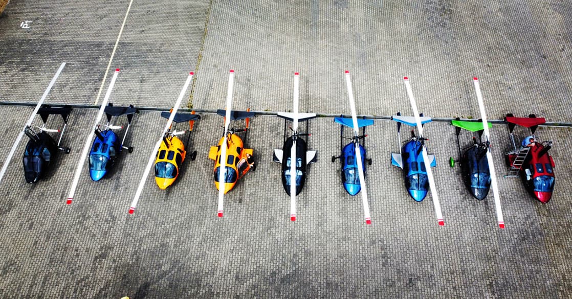 Line-up of ARGON gyroplanes in different colours at the factory airfield