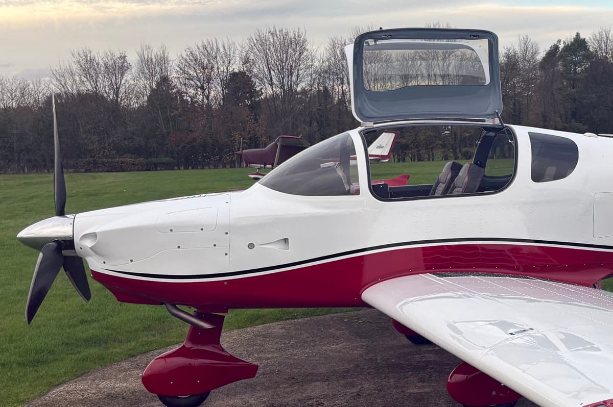 Sling TSi cockpit with the canopy raised, showing leather seats and the glass panel